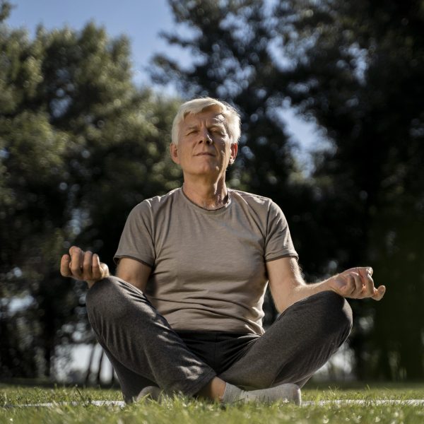 front-view-older-man-lotus-position-outdoors-during-yoga